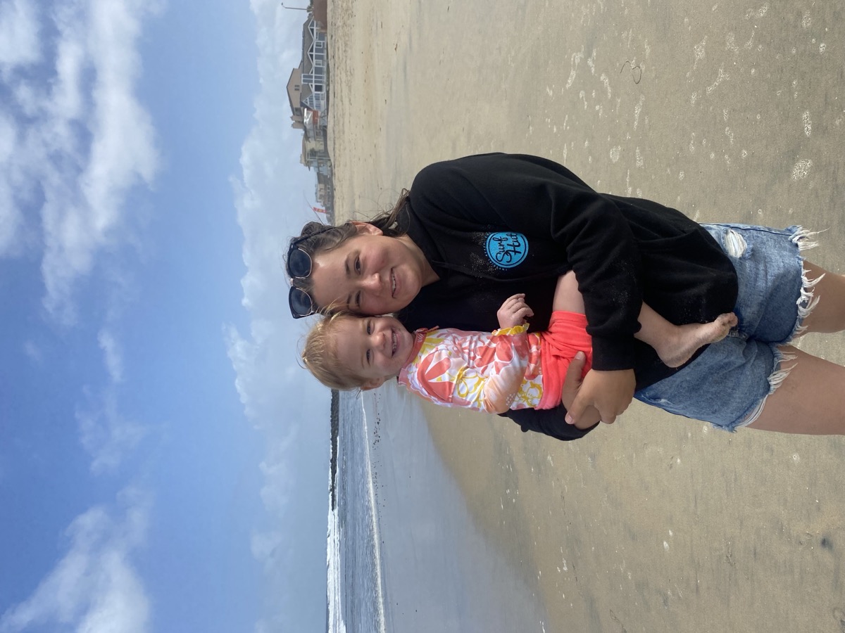 Soraya at the beach with child