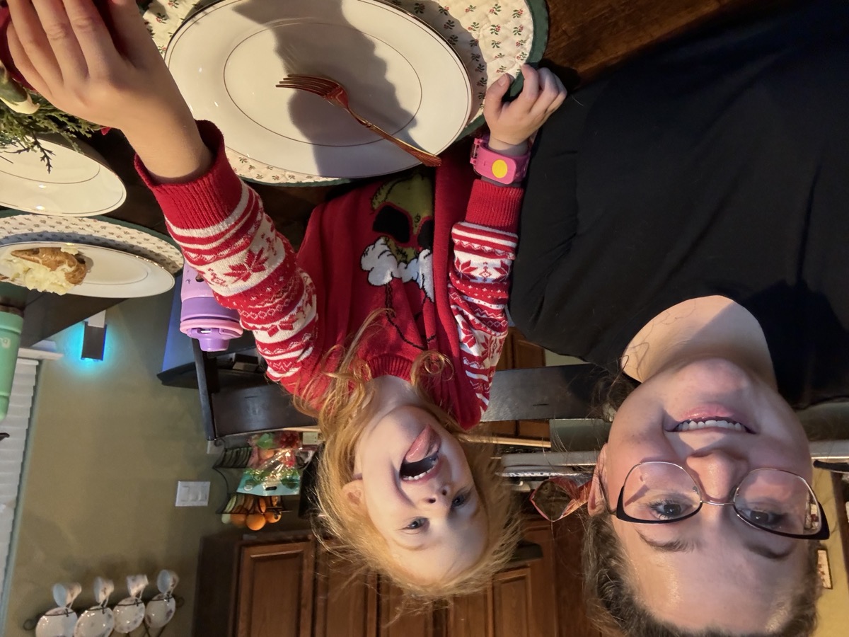 Soraya with child at dinner