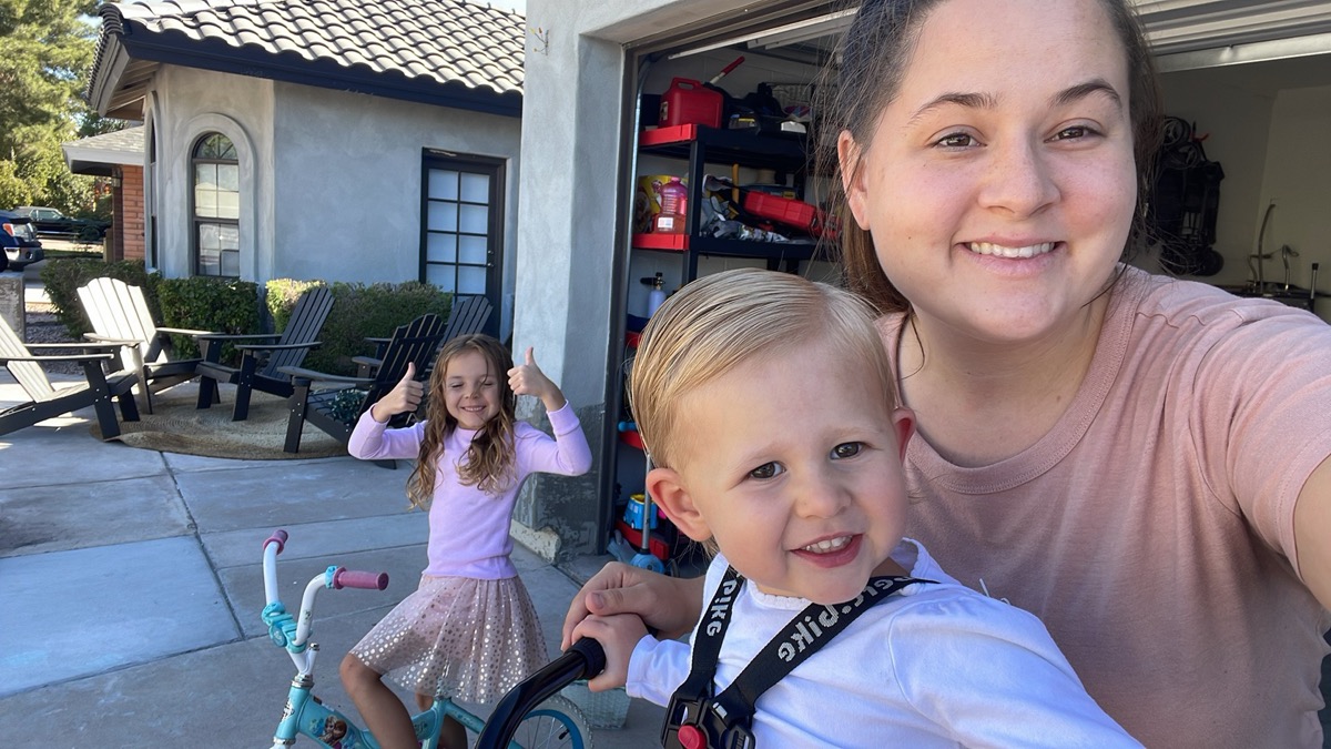 Soraya with kids outdoors, smiling